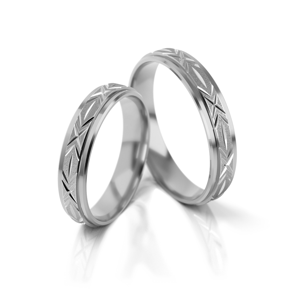 
                  
                    Dviejų spalvų vestuviniai žiedai su graviruotu raštu
                  
                