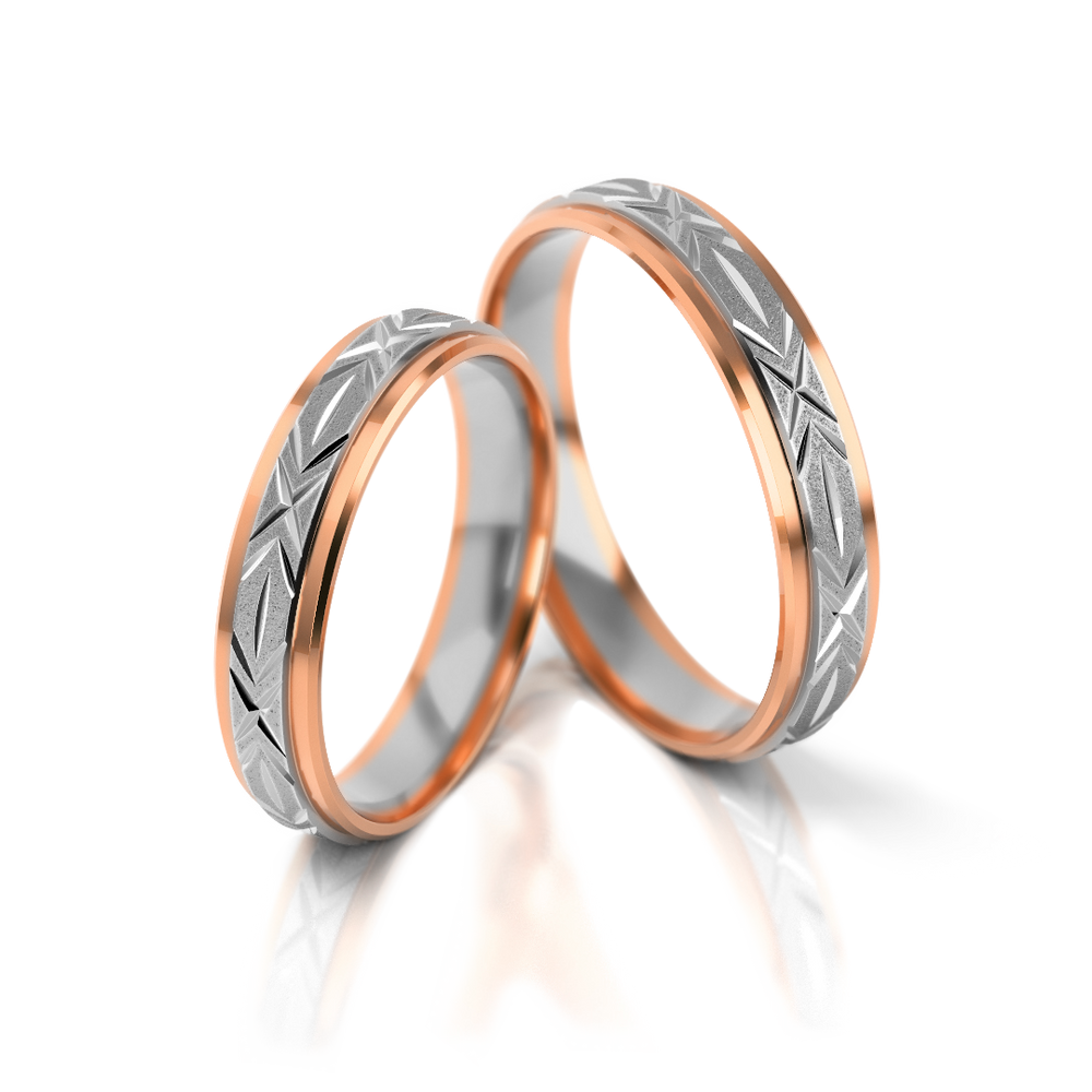 
                  
                    Dviejų spalvų vestuviniai žiedai su graviruotu raštu
                  
                