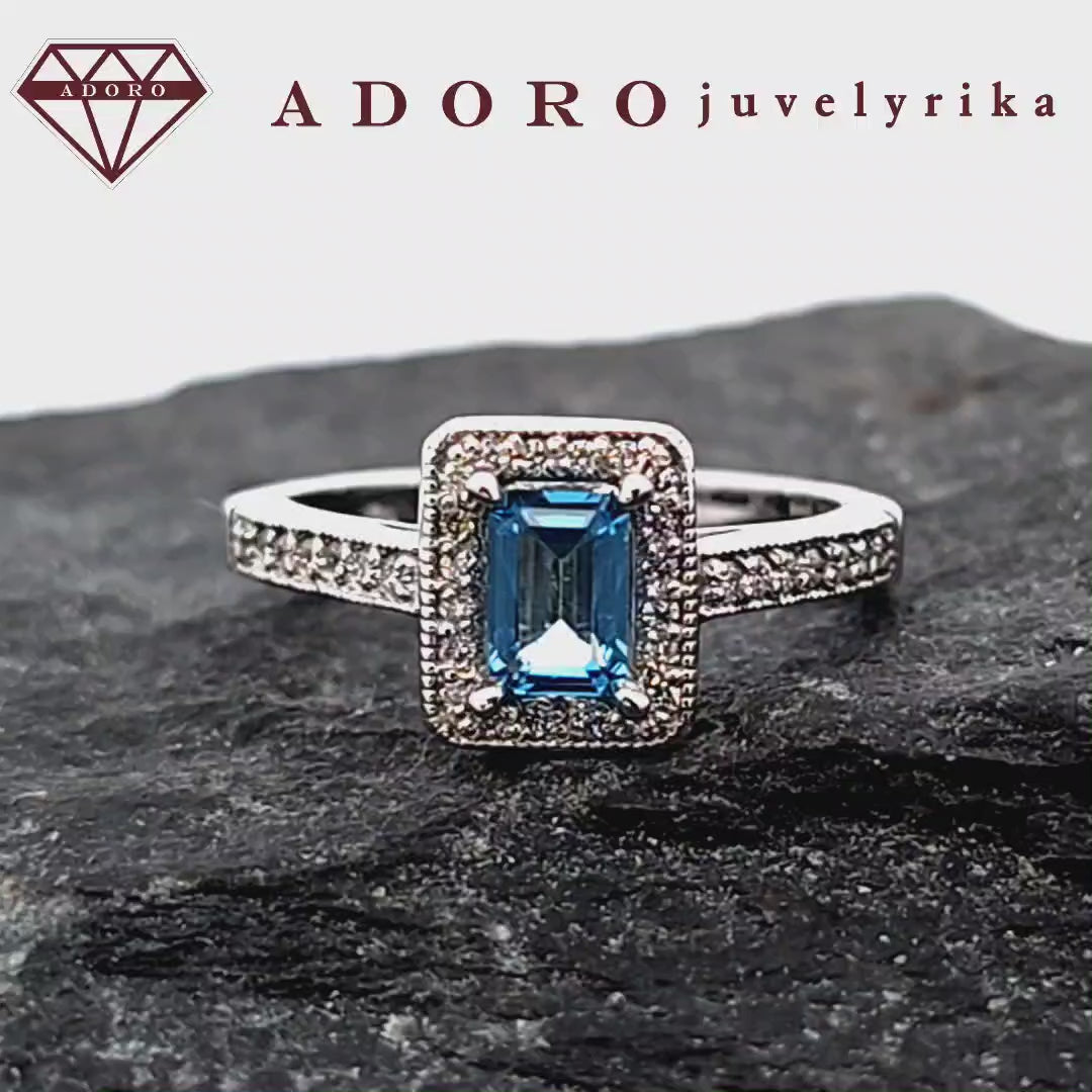 Baltas auksinis žiedas su mėlynu topazu ir deimantais – ADORO juvelyrika